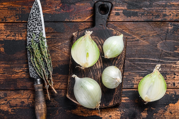 White raw onion in wooden box