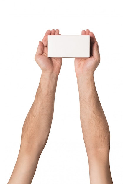 White rectangular box in male hands. Top view. Isolate