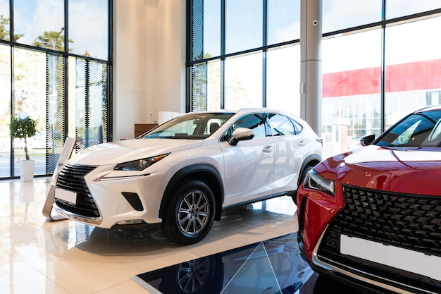 White and red car in a dealership car sale luxury brand