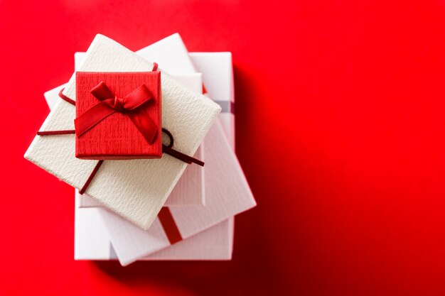 White and red gift boxes top view copyspace