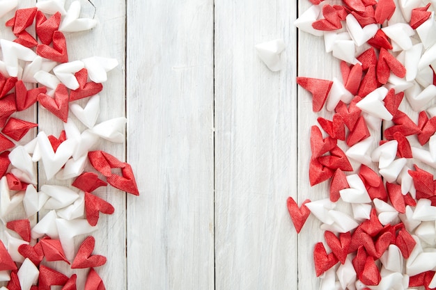 White and red  paper heart on wooden