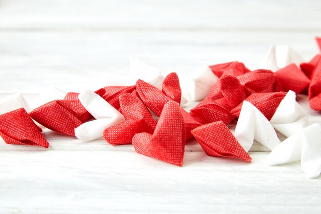 White and red  paper heart on wooden