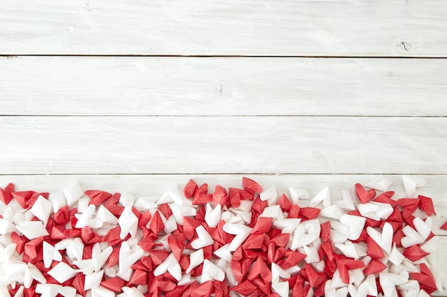 White and red  paper heart on wooden