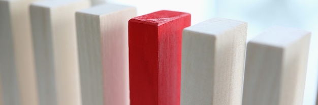White and red wooden blocks stands on a table