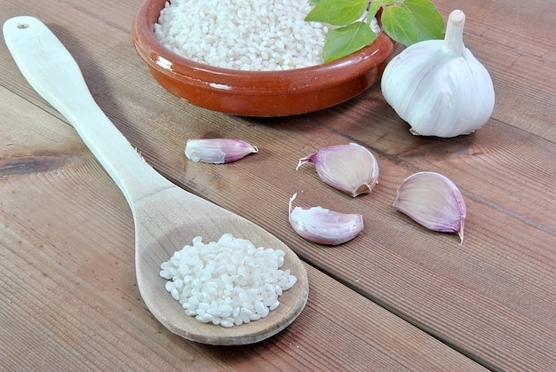 White rice in bowl of mud and wooden table