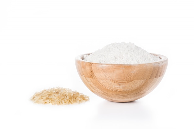 White rice flour in a bowl isolated on white