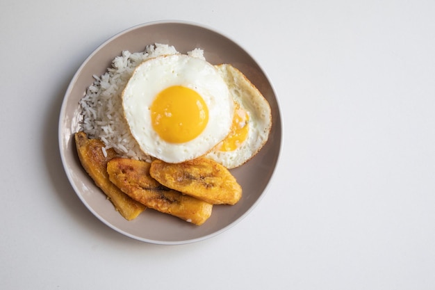 White rice with english fried egg and fried bananas cuban food simple comfort food