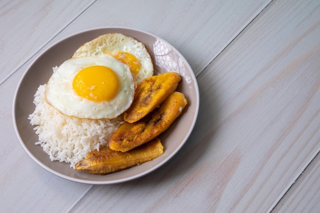 White rice with english fried egg and fried bananas cuban food simple comfort food