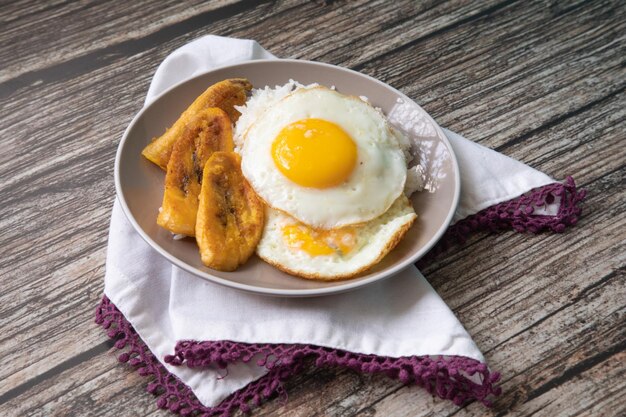 White rice with english fried egg and fried bananas cuban food simple comfort food