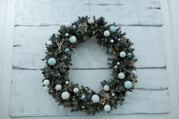 white room with fireplace. fireplace in the bedroom with Christmas decoration. wreath over the firep