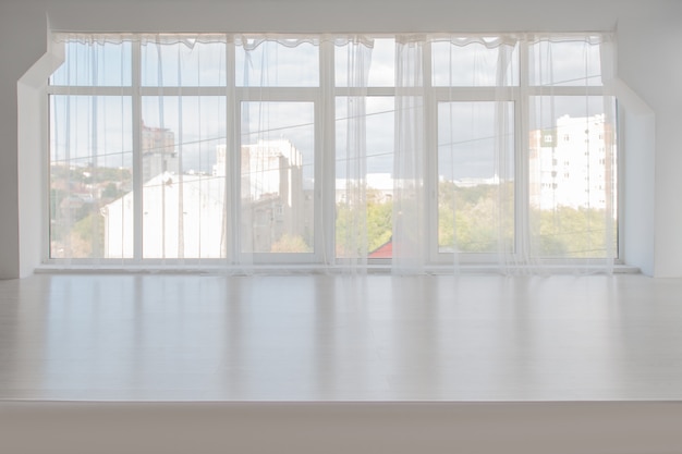 White room with large windows