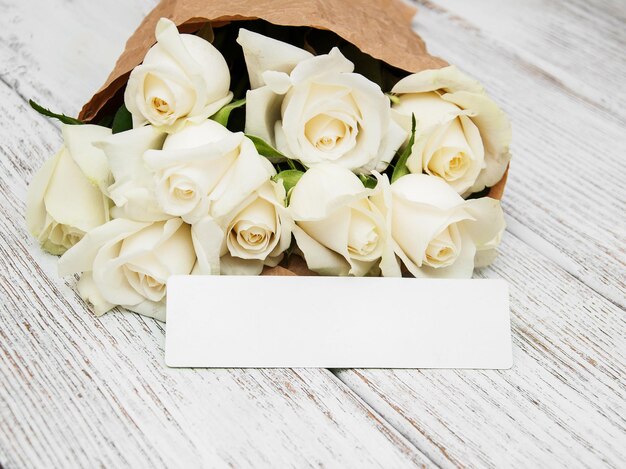 White roses with tag