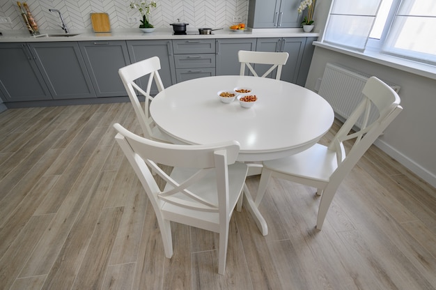 White round dining table and chairs for four