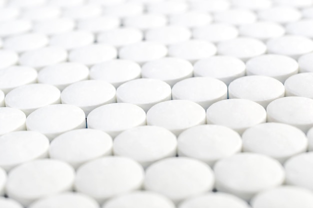 White round pills as medical background