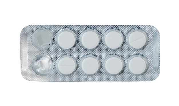 white round pills in blister pack laid on a flat surface