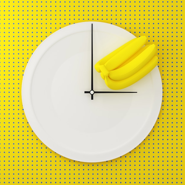 white round plate with banana in a form of clock on point pattern yellow background