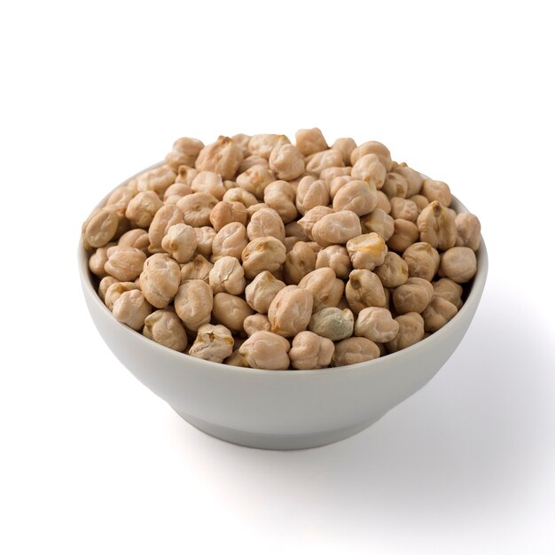 White round pot full of uncoked chickpea. isolated on white.