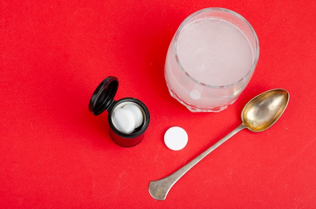 White round tablets, soluble in glass of water. Studio Photo