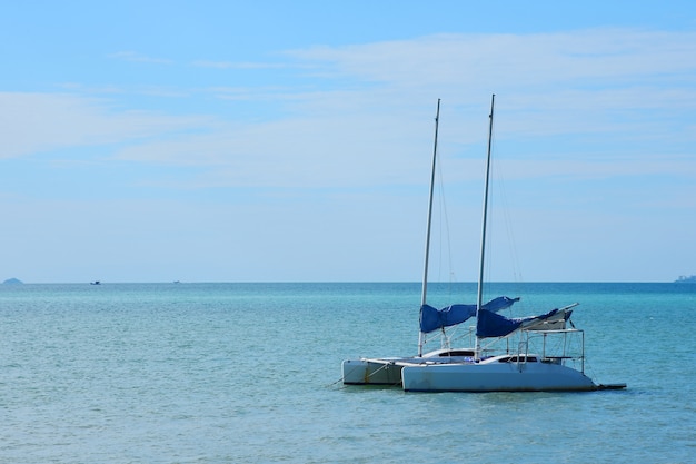 The White sailboat yacht floating in the sea of Pattaya city.