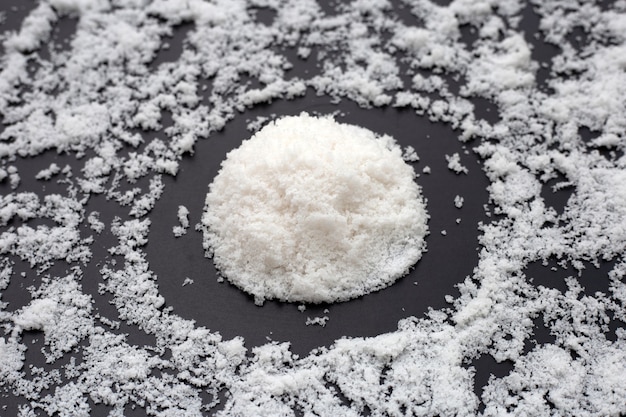 White salt on dark background.