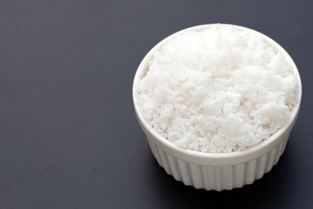 White salt on dark background.