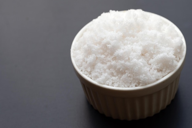 White salt on dark background