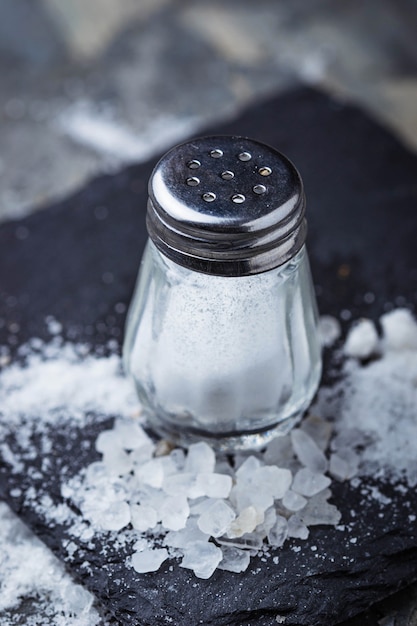 White salt in shaker. Selective focus