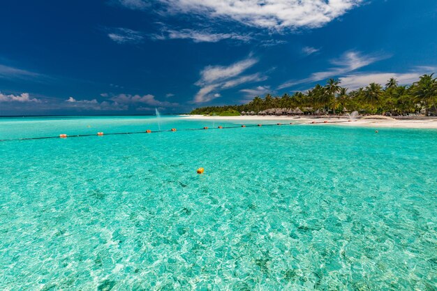 White sandy beach in Maldives with amazing blue lagoon