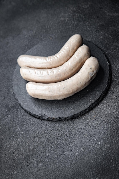 white sausage raw weisswurst sausages spice meal food snack on the table copy space food