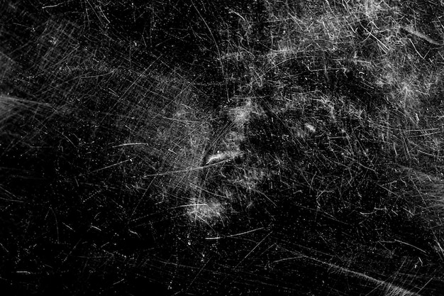 White scratches on a black background. chaotic scratched glass. High quality photo