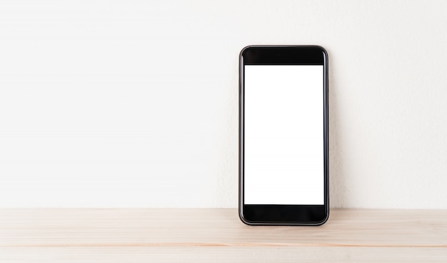 Photo white screen phone rests against the wall.