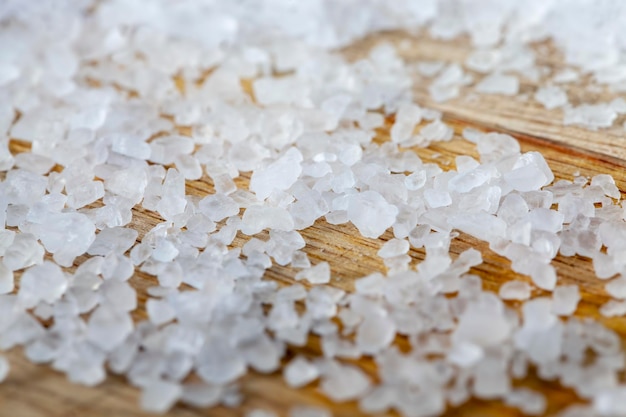 White sea salt on a wooden board