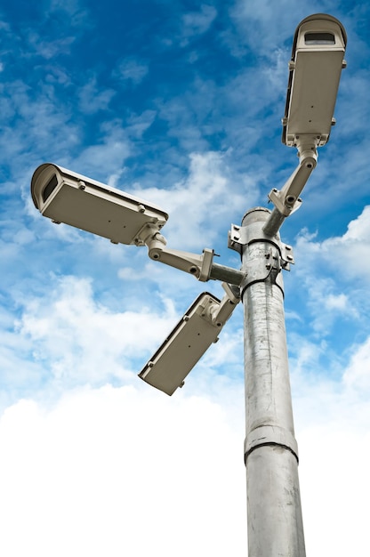 White Security Cameras Group On Steel Pillar