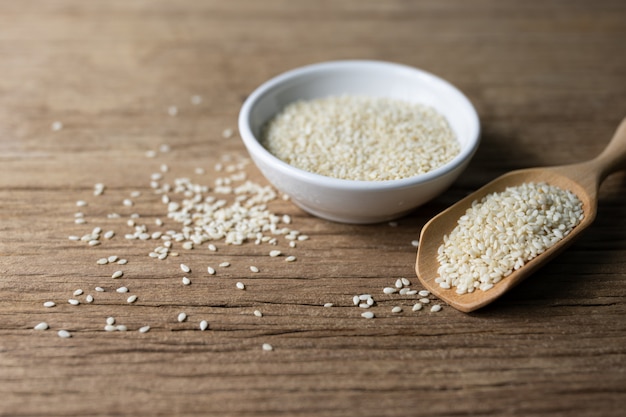 White sesame natural supplement on rustic wood