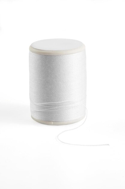 White sewing thread spool on a whitexA