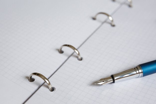 White sheet of exercise book or diary and fountain pen