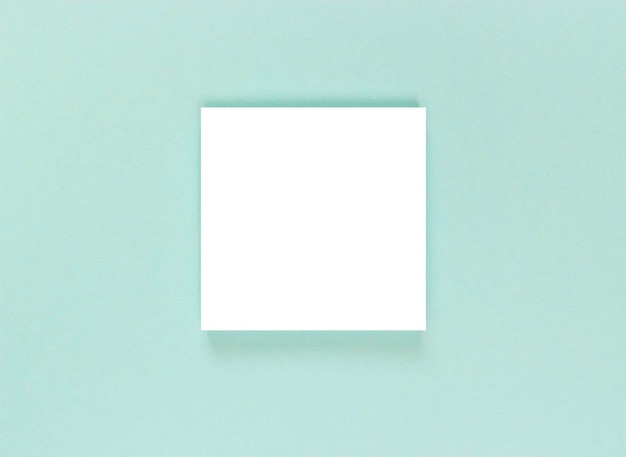 white sheet of paper on a blue textured background