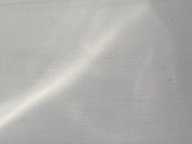 A white sheet of paper with a light reflection on it