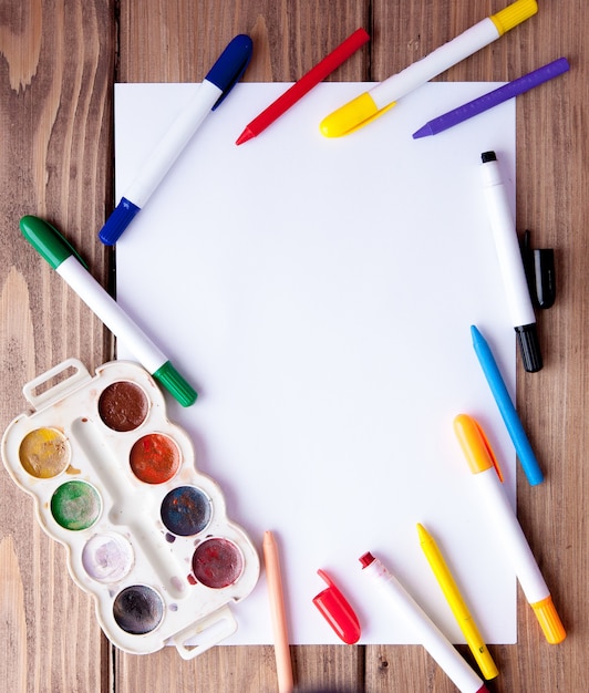 White sheet of paper on a wooden table