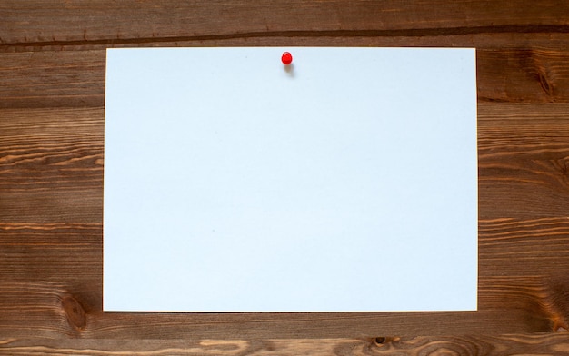 The white sheet on a wooden background.