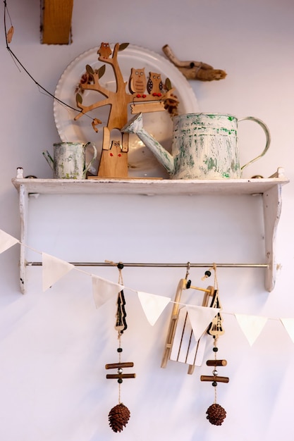 Photo white shelf with two metal painted watering heads