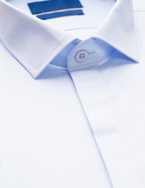 White shirt with a focus on the collar and button closeup