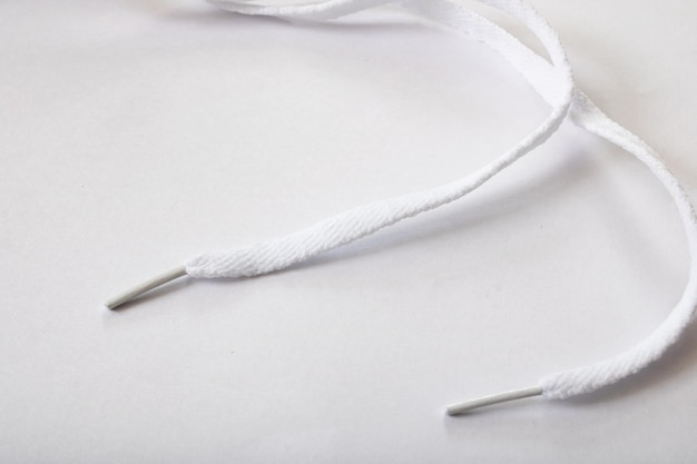 White shoelaces on a white background closeup