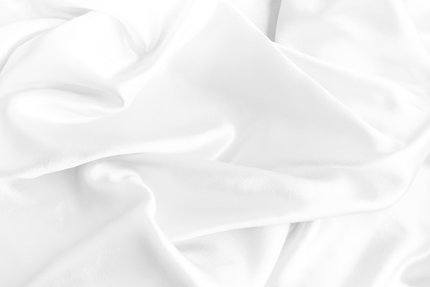 White silk texture luxurious satin for abstract background. beautiful white fabric, soft focus