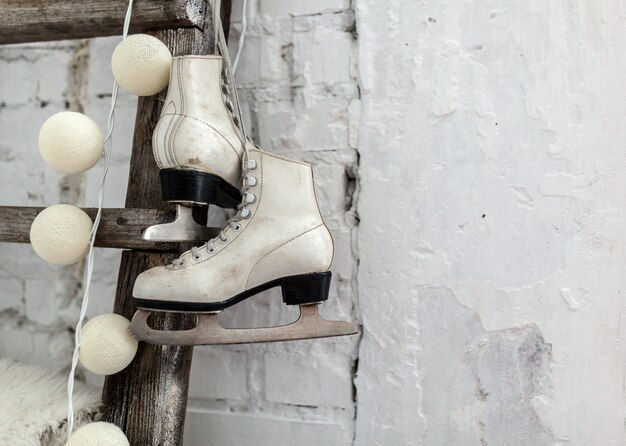 White skates at the wooden staircase Happy New year 