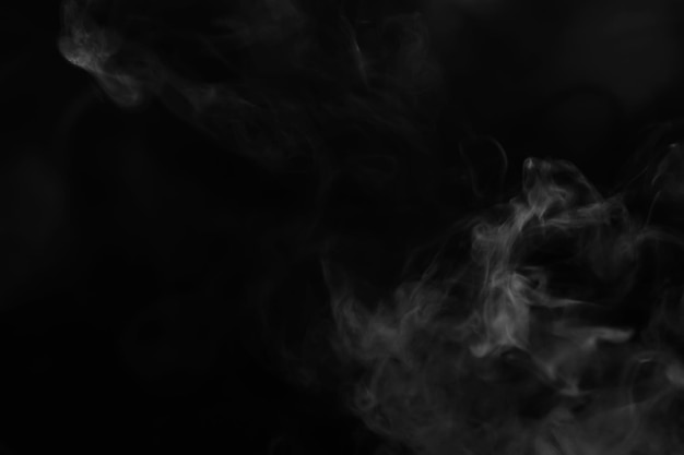 Photo white smoke over black background for overlay design