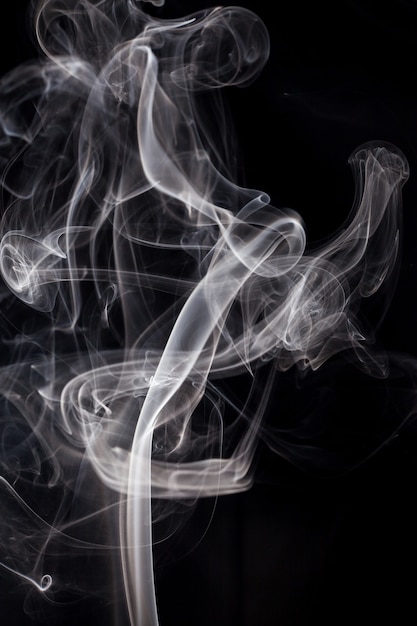 White smoke on black background.