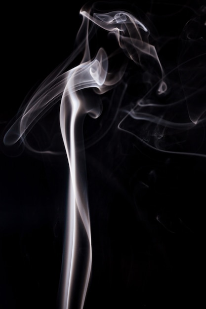 White smoke on black background.