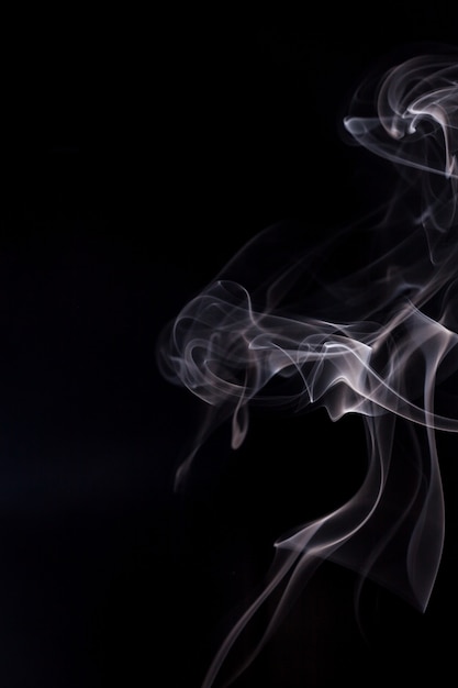 White smoke on black background.