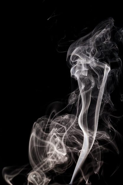 White smoke on black background.